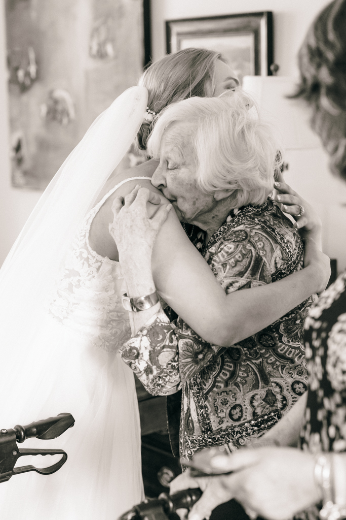 Bride hugging grandmother upon her arrival to Glen Ellen Farm prior to the wedding ceremony