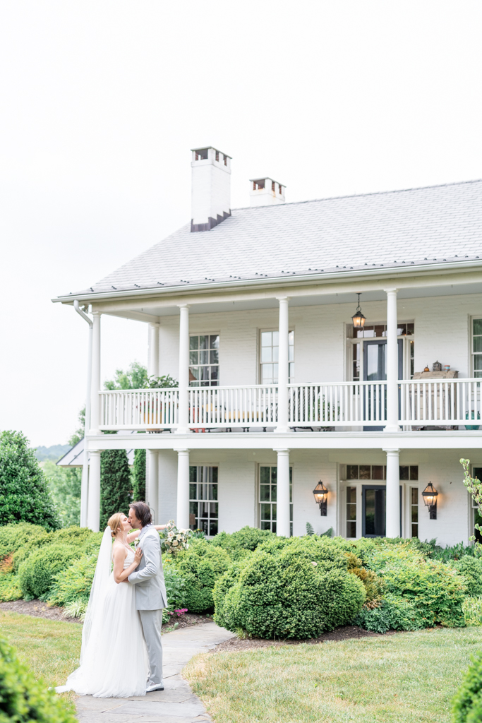 Bridal and groom portraits in front of the Manor House at Glen Ellen Farm