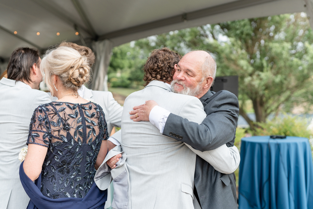Families embracing after wedding ceremony at Glen Ellen Farm in Frederick, MD