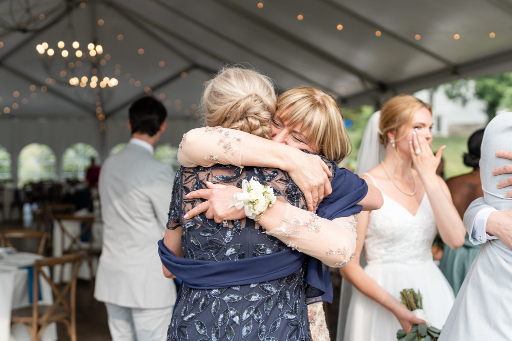 Families embracing after wedding ceremony at Glen Ellen Farm in Frederick, MD