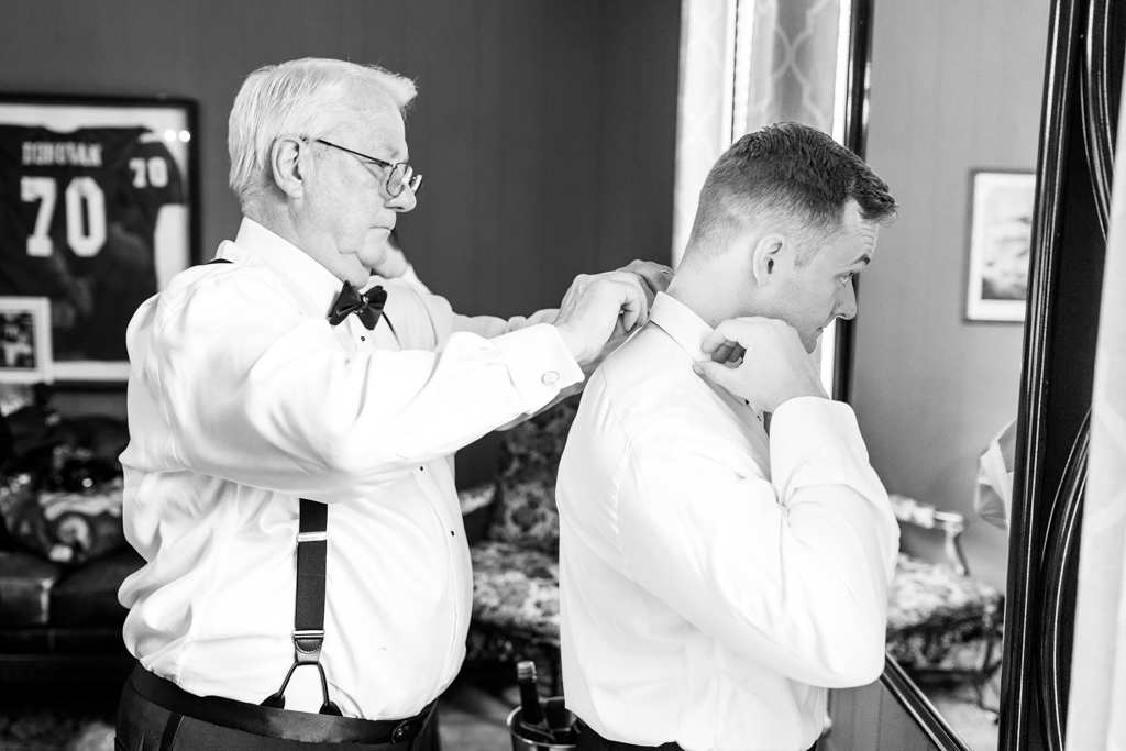 Father of the bride helping his future son in law getting ready for his wedding at Mansion at Valley Country Club in Towson, MD