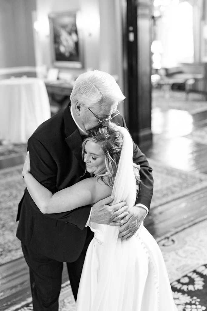 First look with father and daughter on the grand staircase at the Mansion at Valley Country Club in Towson, MD