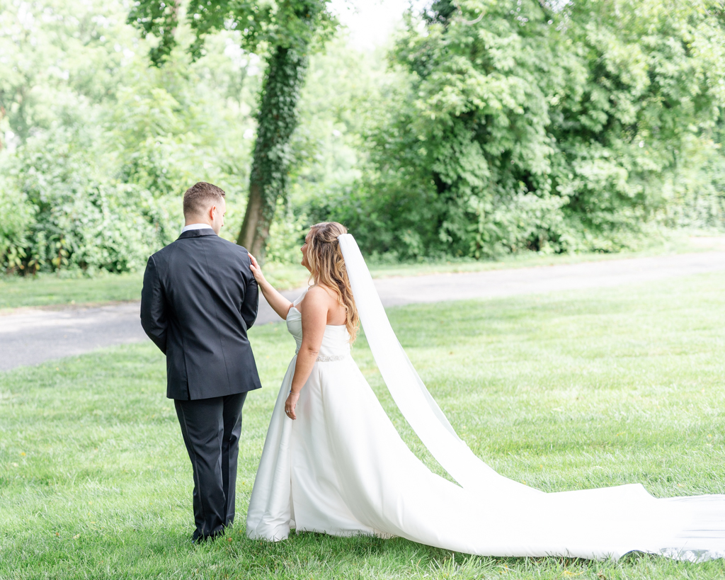 First look with bride and groom outside at the Mansion at Valley Country Club in Towson, MD