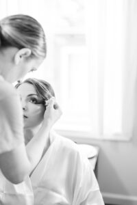 Baltimore bride having the final touches of makeup done in her bridal suite