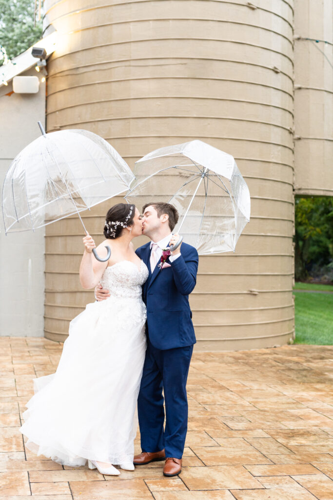 Bride and groom portraits at Silo Falls on a rainy wedding day in Maryland