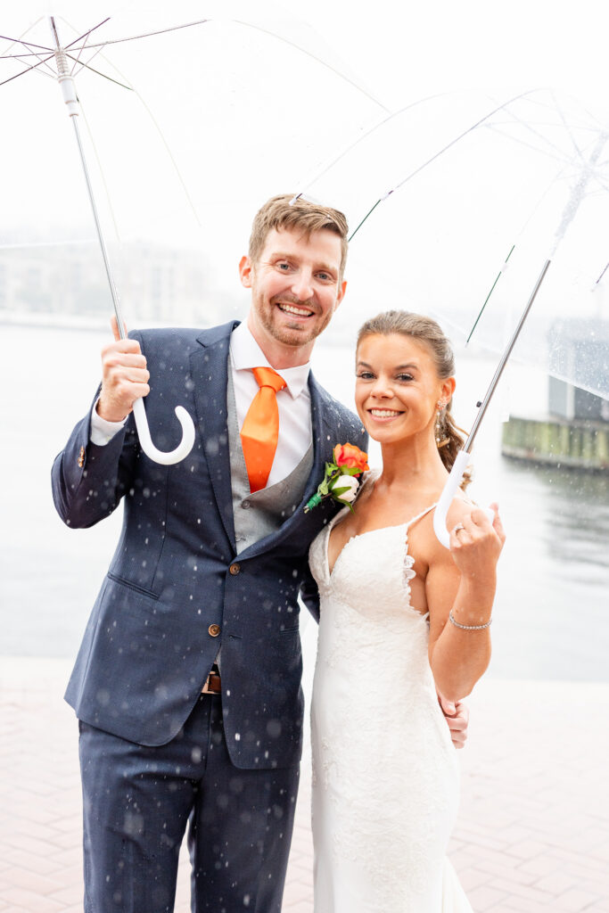 Bride and groom portrait at Baltimore Waterfront on a rainy wedding day