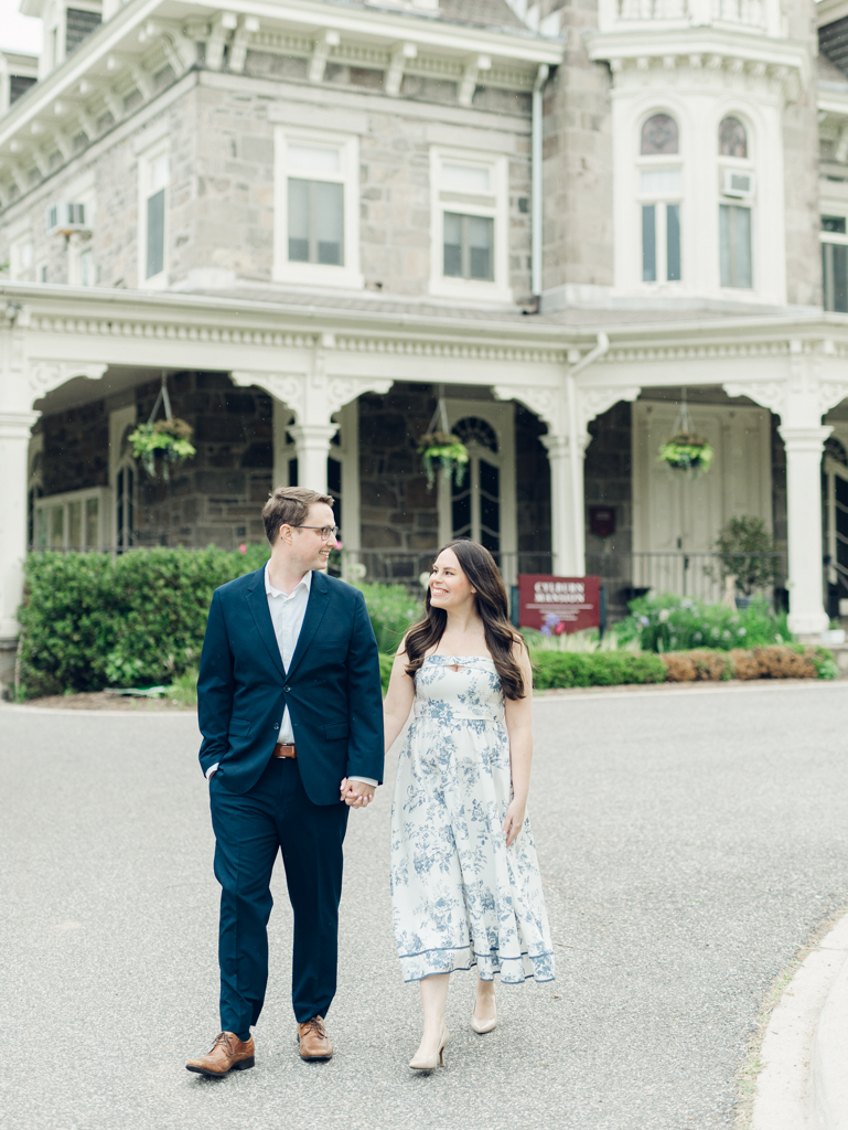 Engaged couple walking at Cylburn Arboretum during their Baltimore engagement session