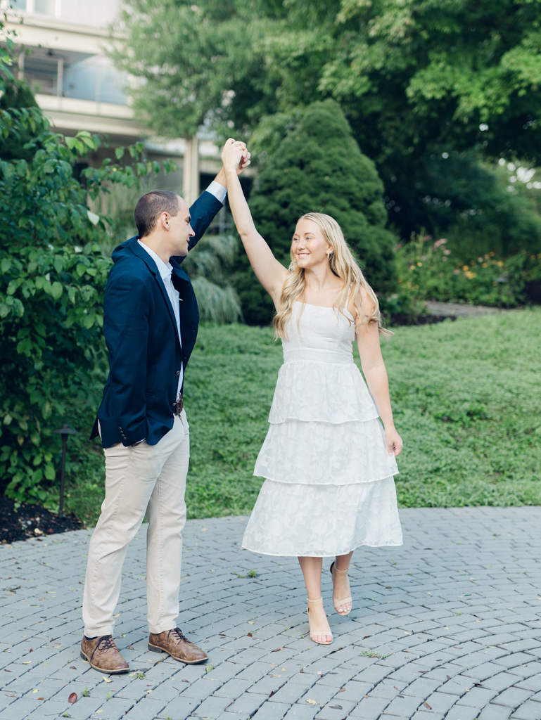 Mac and Abbey dancing during their engagement session at Howard County Conservancy