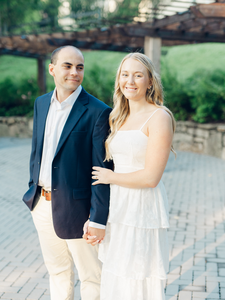 Mac admiring Abbey during their engagement session at Howard County Conservancy