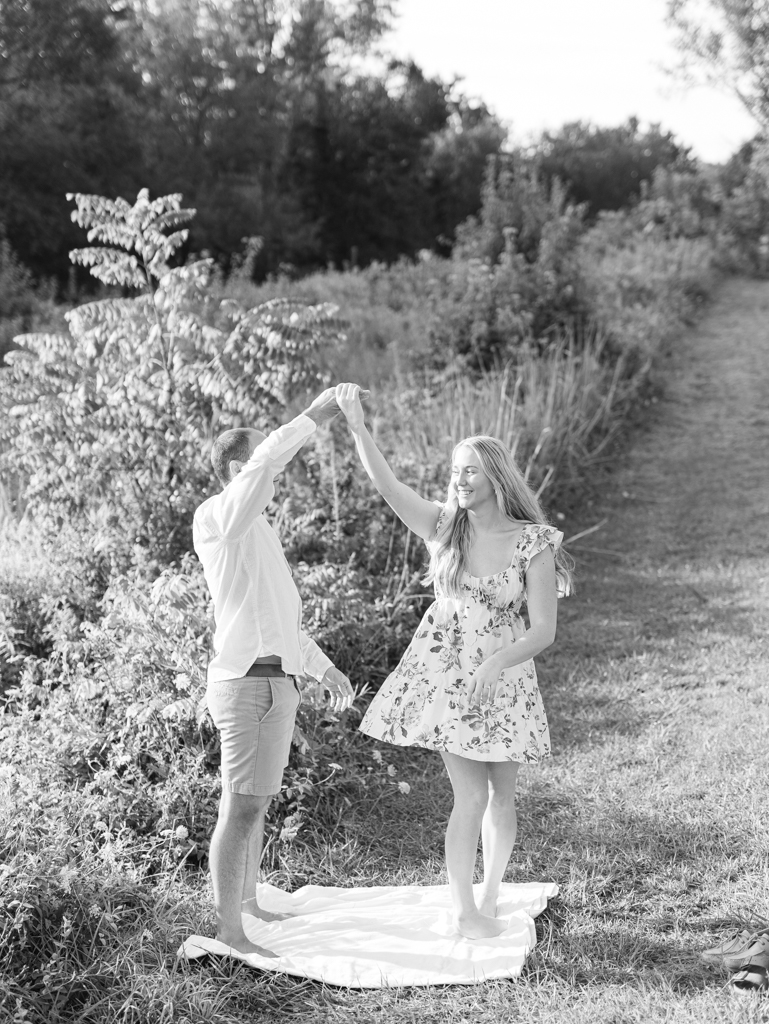 Abbey and Mac dancing in a field at Howard County Conservancy