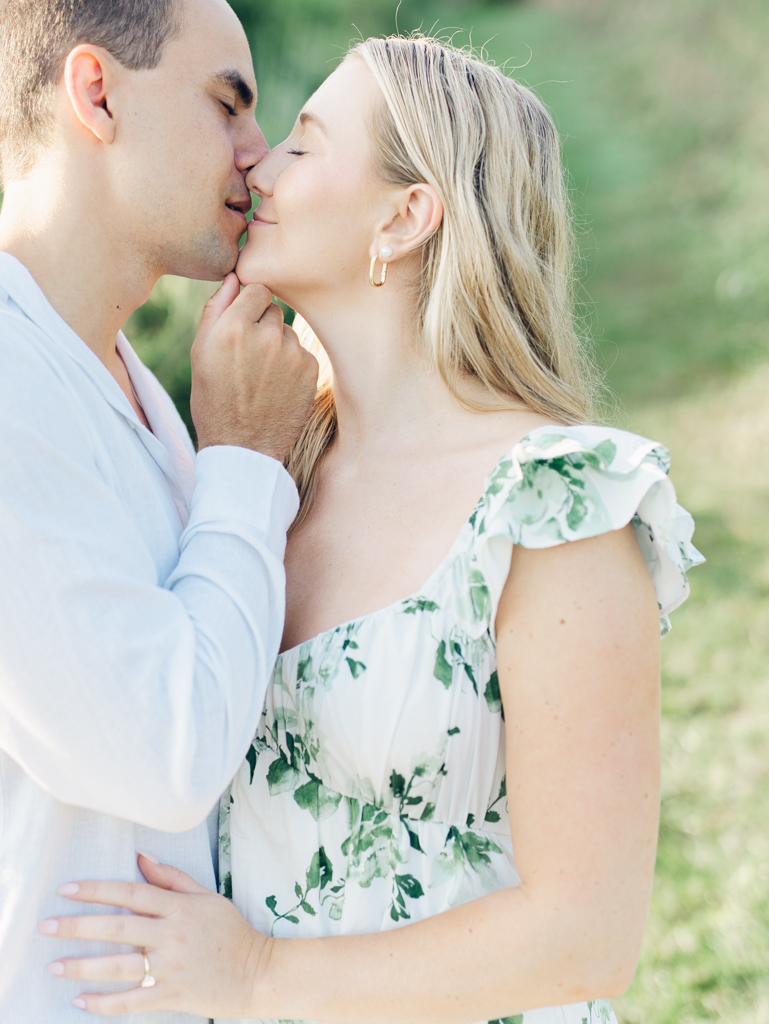 Mac pulling Abbey in for a kiss during their engagement session at Howard County Conservancy