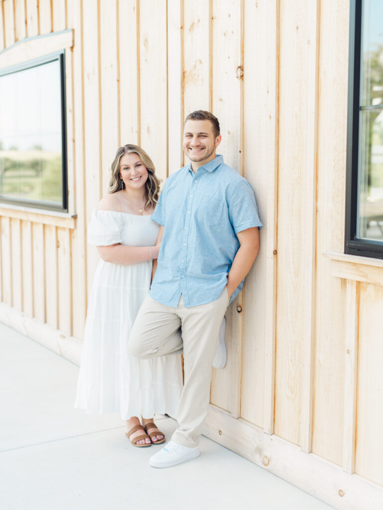 Casey and Giovanni smiling while at Bortner Valley during their engagement session