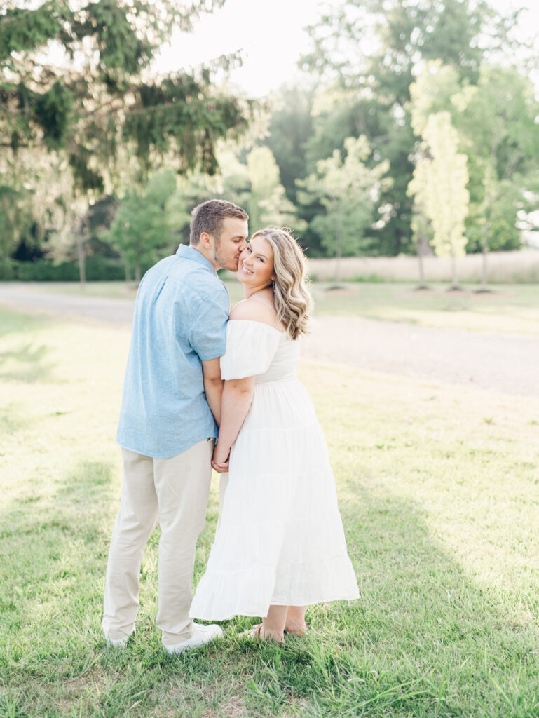 Giovanni giving Casey a kiss on the cheek during goldeen at Bortner Valley during their engagement session