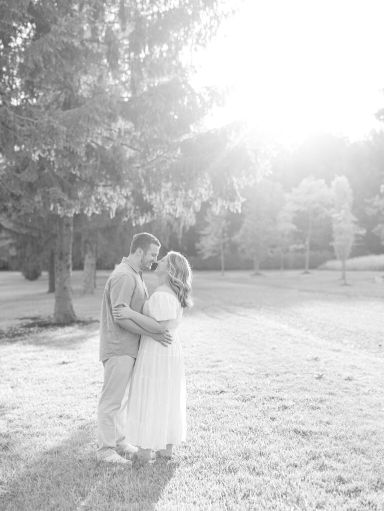 Casey and Giovanni smiling together at Bortner Valley during their engagement session