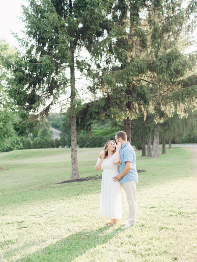 Casey and Giovanni sharing a moment together near the pond at Bortner Valley during their engagement session