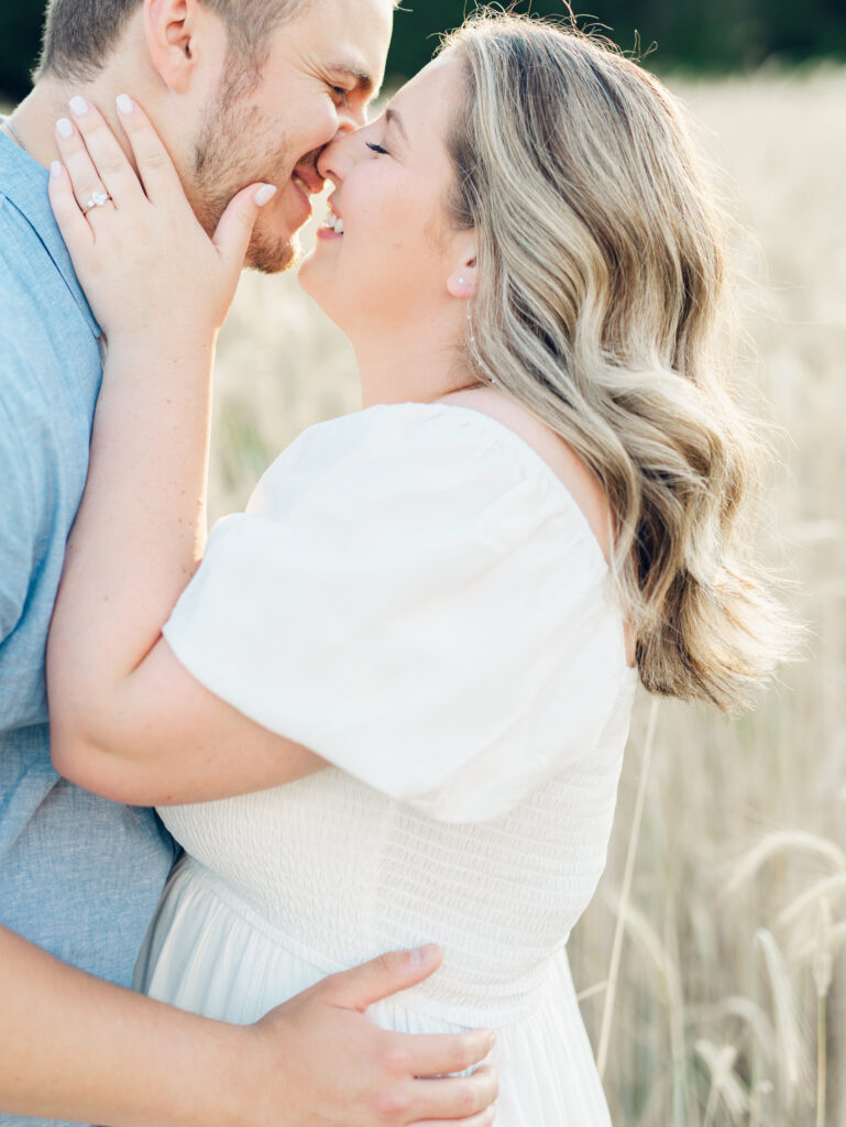 Casey and Giovanni laughing with each other at Bortner Valley during their engagement session