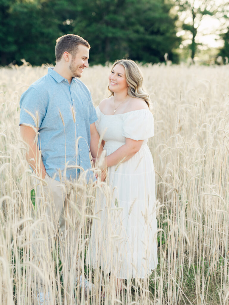 Casey and Giovanni laughing with each other at Bortner Valley during their engagement session