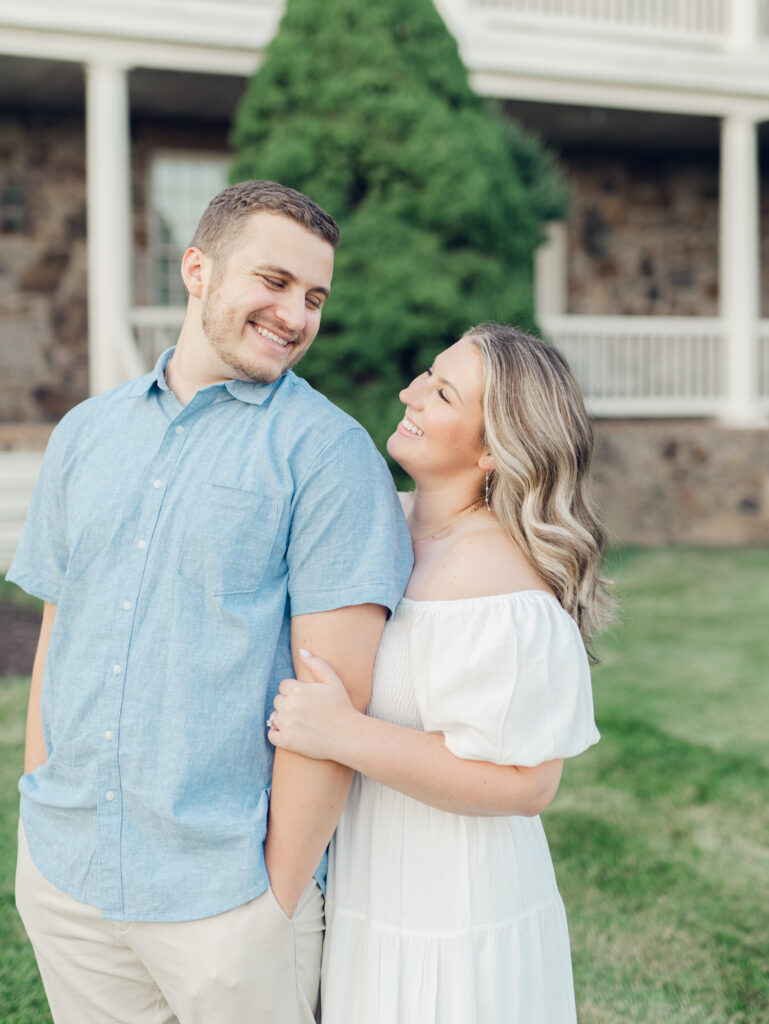 Casey and Giovanni laughing with each other at Bortner Valley during their engagement session