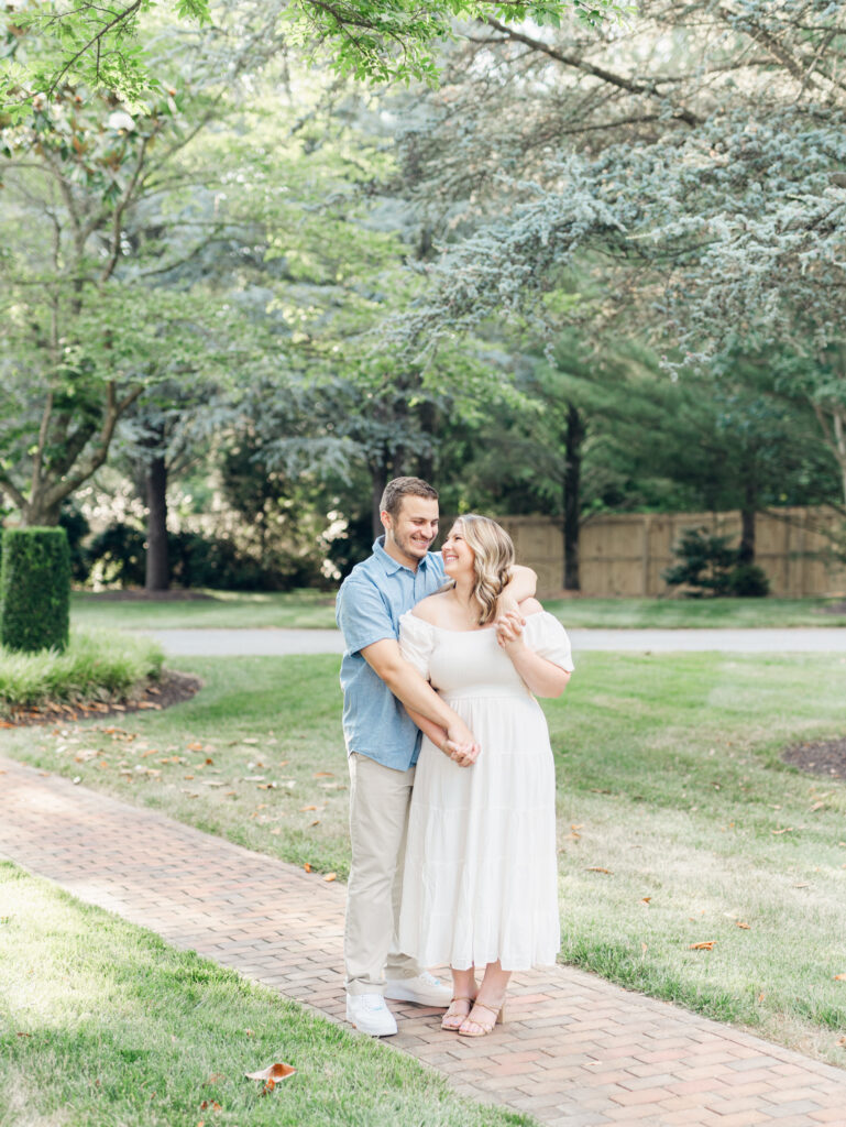 Casey and Giovanni laughing with each other at Bortner Valley during their engagement session