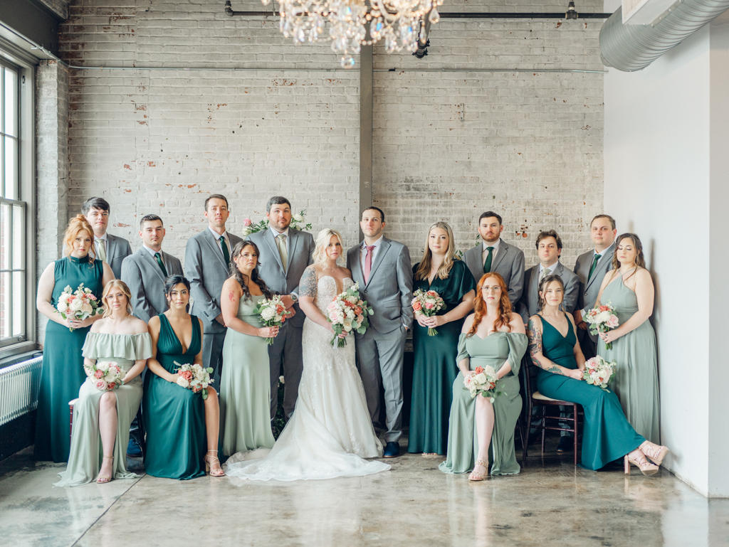 Amanda and Corey with their wedding party in the industrial space inside The Bond Events. 