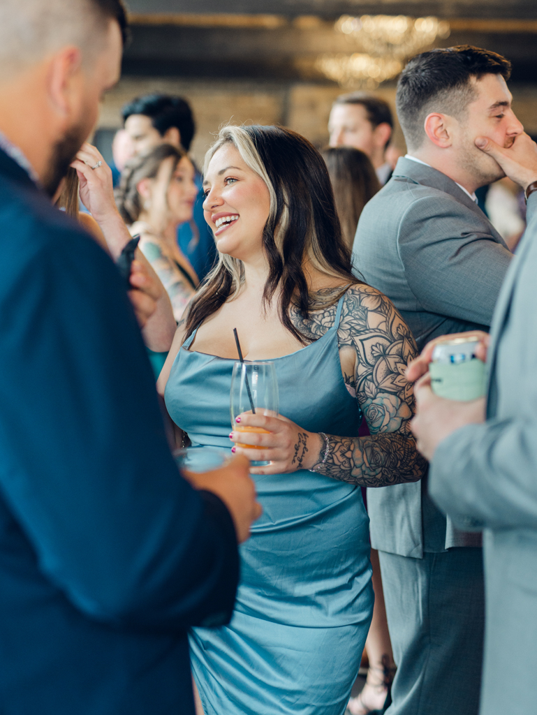 Guests interacting during cocktail hour in The Royal Square Gardens on Amanda and Corey's wedding day at The Bond Events.