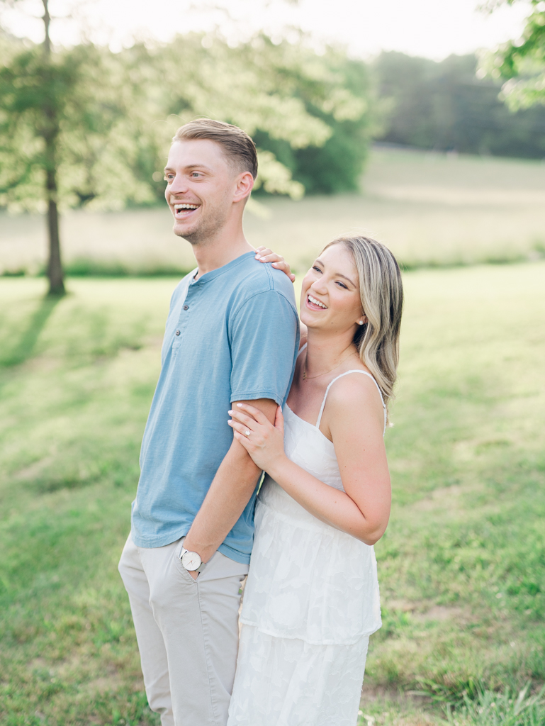 Cold Saturday Farm engagement session with Victoria and Jacob laughing together during golden hour
