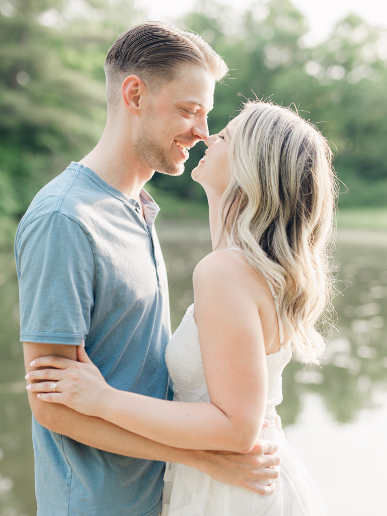 Victoria & Jacob smiling together during golden hour for their engagement session at Cold Saturday Farm