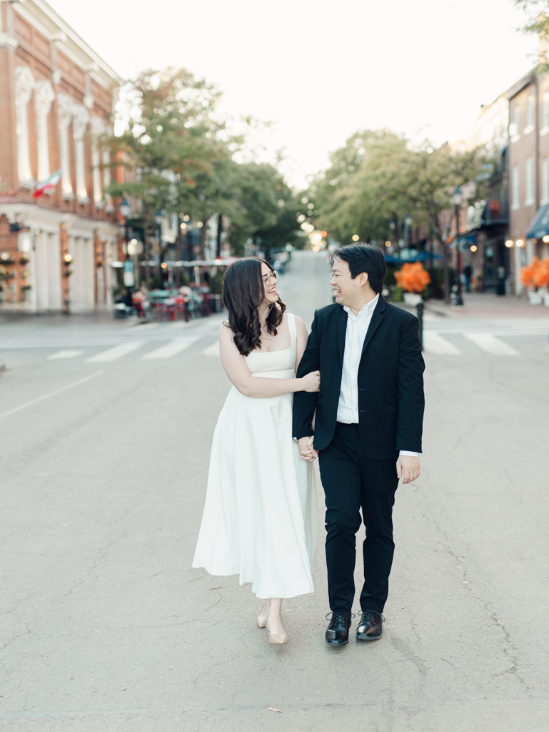 Chelsea & Wes crossing the street during their Old Town Alexandria engagement session