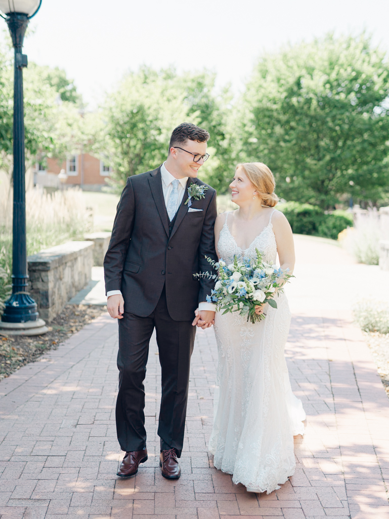 Anna and Sam taking portraits along Carroll Creek before their McClintock Distilling Wedding in Frederick, Maryland