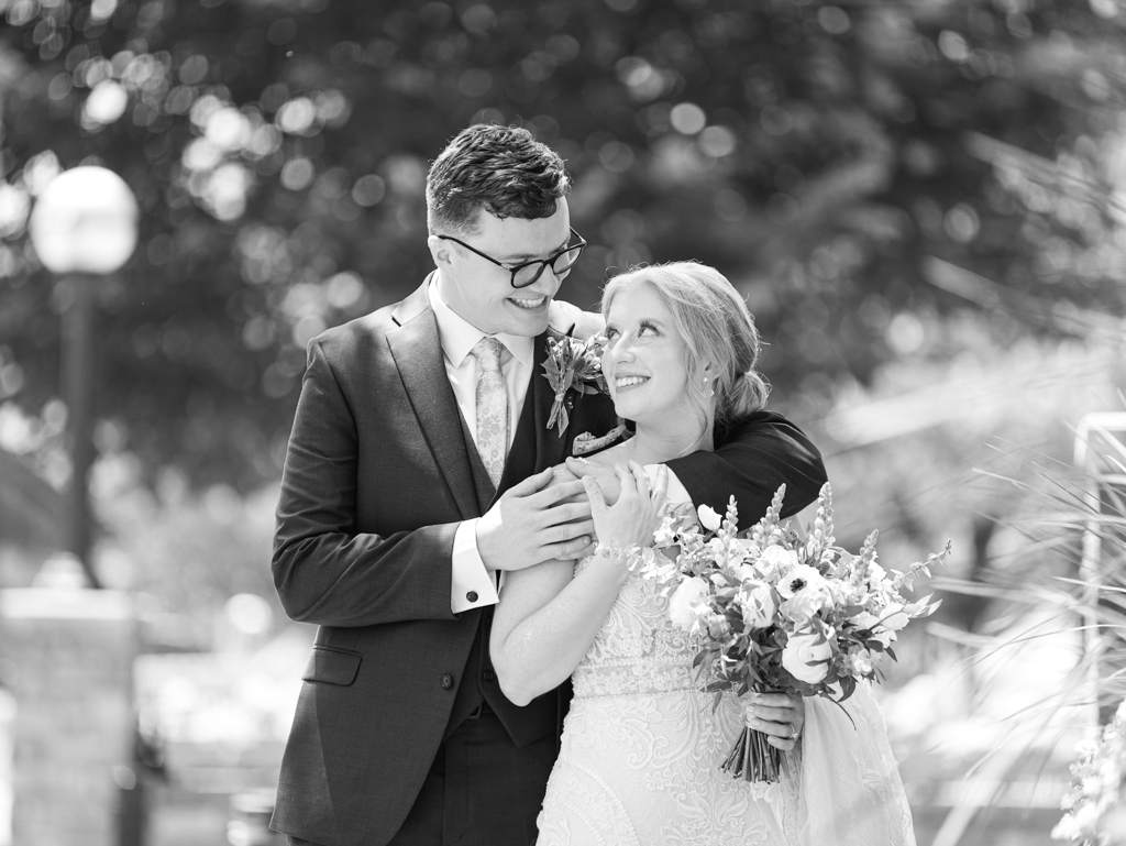 Anna and Sam taking portraits along Carroll Creek before their McClintock Distilling Wedding in Frederick, Maryland