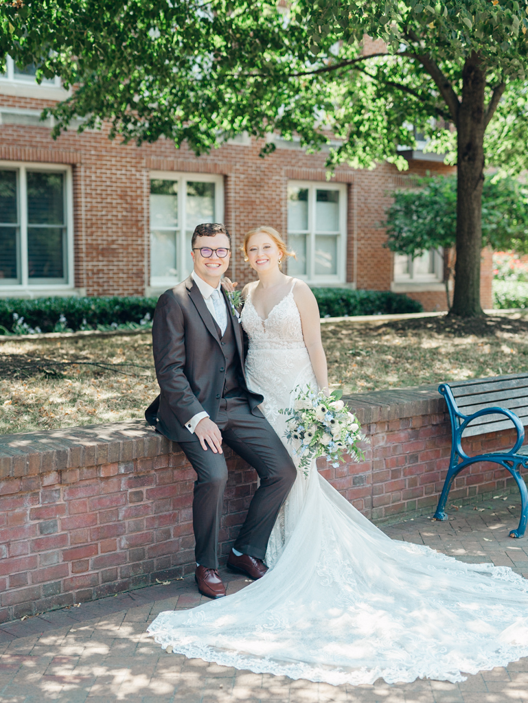 Anna and Sam taking portraits along Carroll Creek before their McClintock Distilling Wedding in Frederick, Maryland