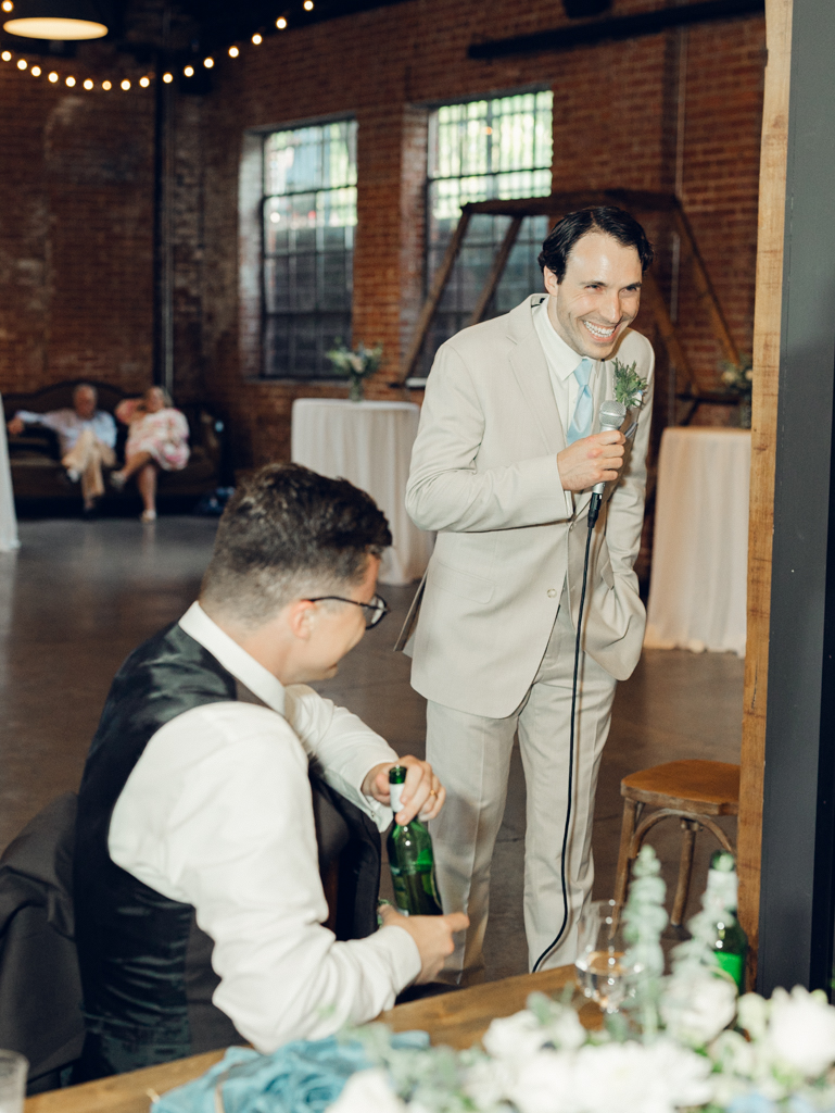 Toasts during Anna and Sam's McClintock Distilling Wedding in Frederick, Maryland