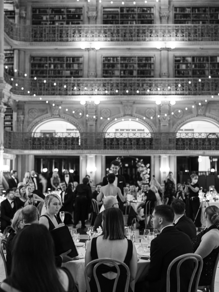 2025 Wedding predictions: intimate wedding celebration at George Peabody Library. Guests watching newlyweds during their first dance. 