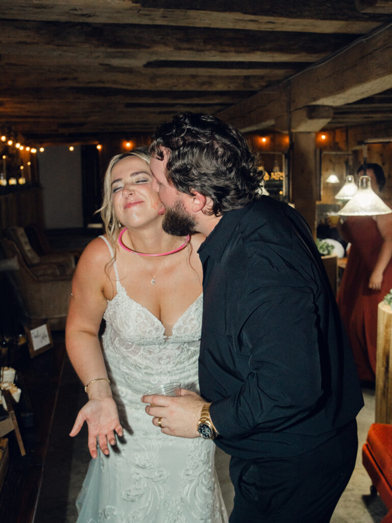 bride and groom cutting cake on their wedding day at The Hummingbird Chateau