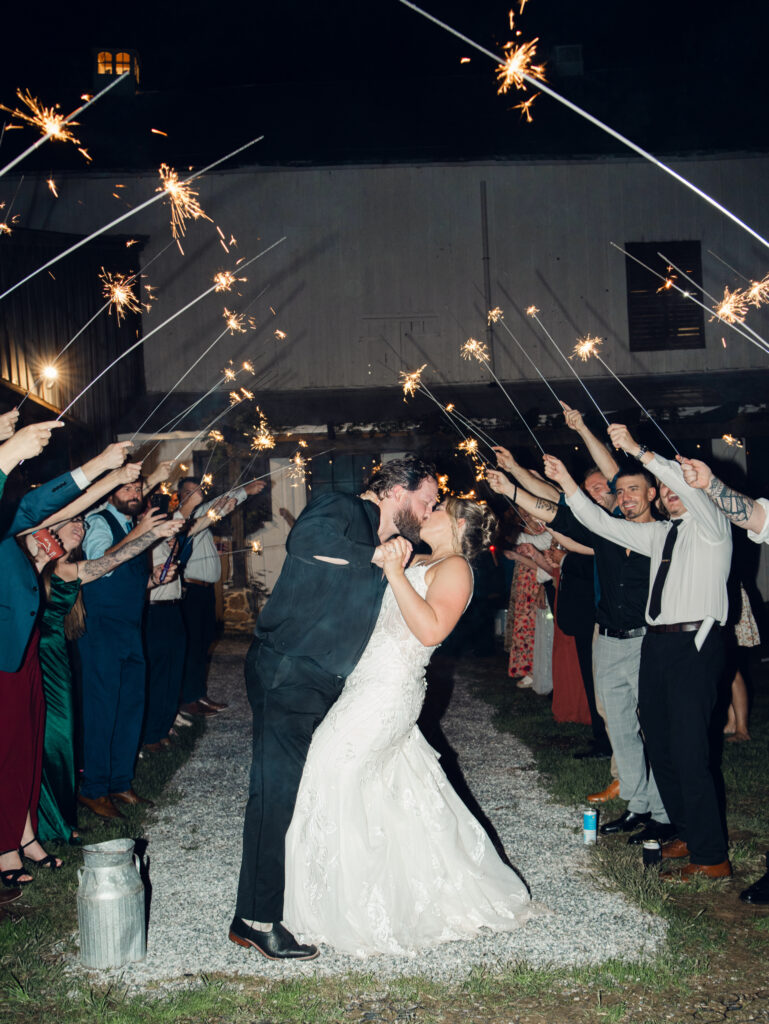 bride and groom during their sparkler exit on their wedding day at The Hummingbird Chateau in Manchester, MD