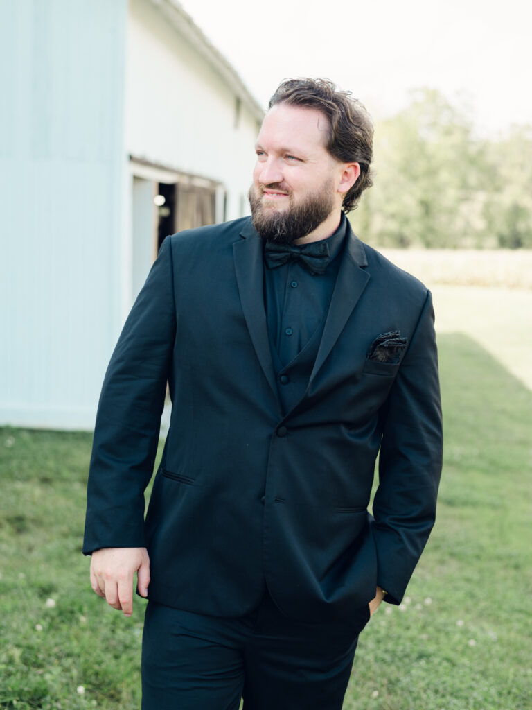 groom smiling on his wedding day at The Hummingbird Chateau