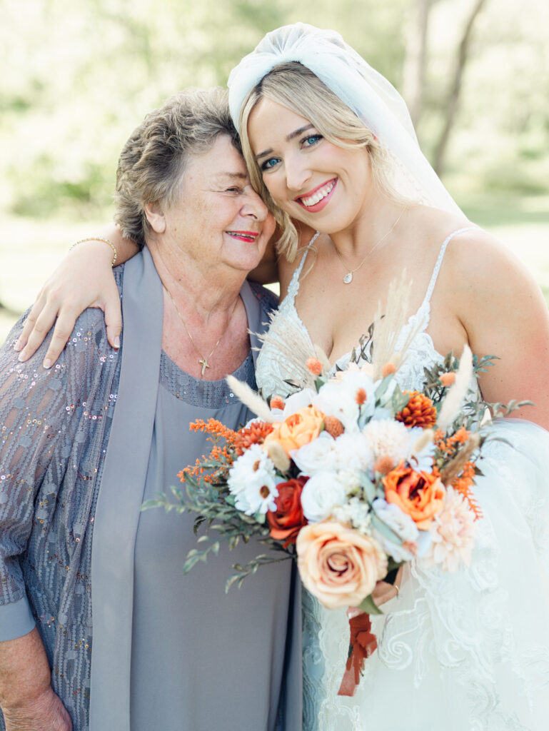 bride hugging her grandma on her wedding day before her ceremony