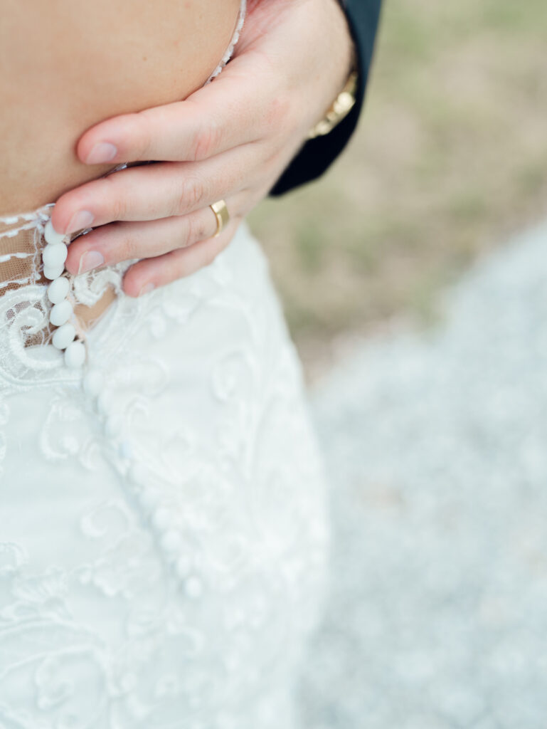 groom's hand with wedding ring