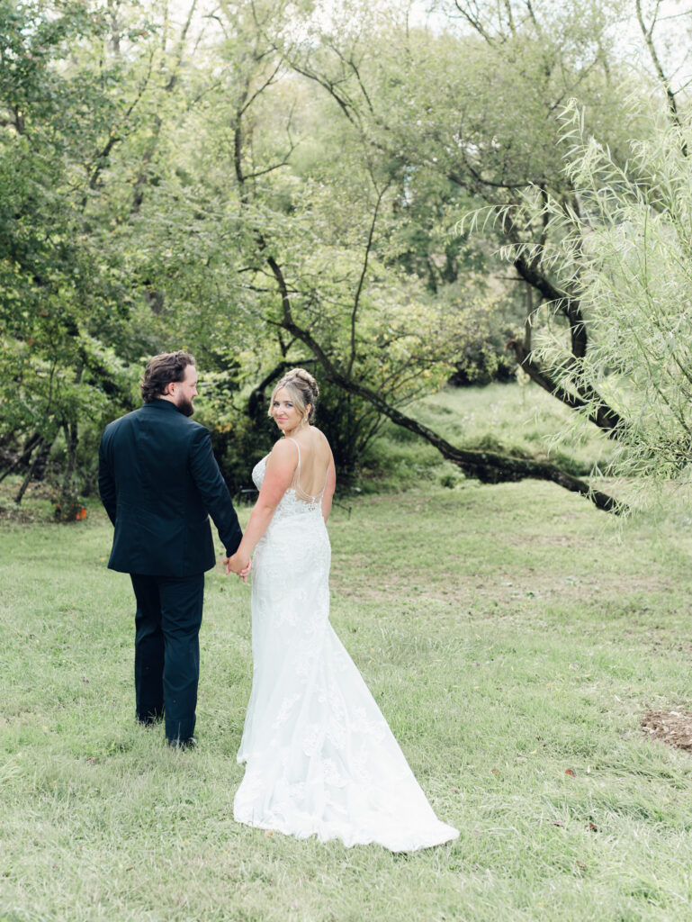 groom admiring his bride at their The Hummingbird Chateau wedding day