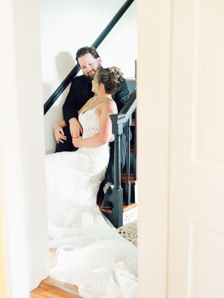 bride and groom enjoying a private moment inside the manor house at The Hummingbird Chateau on their wedding day. 