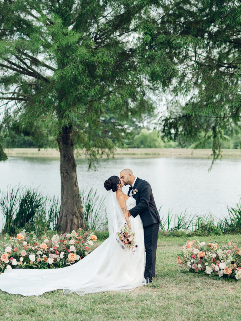 bride and groom taking photos at their wedding venue Bortner Valley in Hampstead, MD