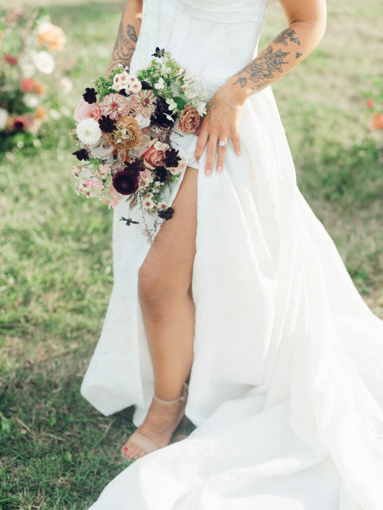 bridal bouquet and wedding gown details at Bortner Valley a Hampstead, MD wedding venue by Sunset Florals