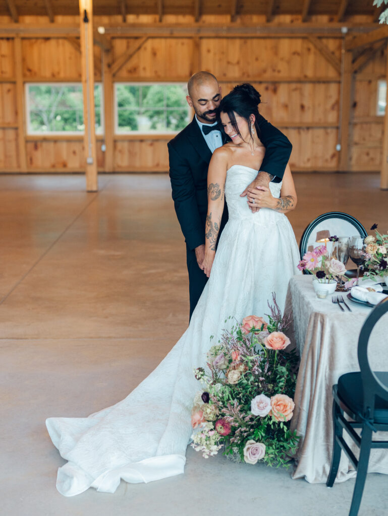 bride and groom taking photos in their wedding venue Bortner Valley in Hampstead, MD