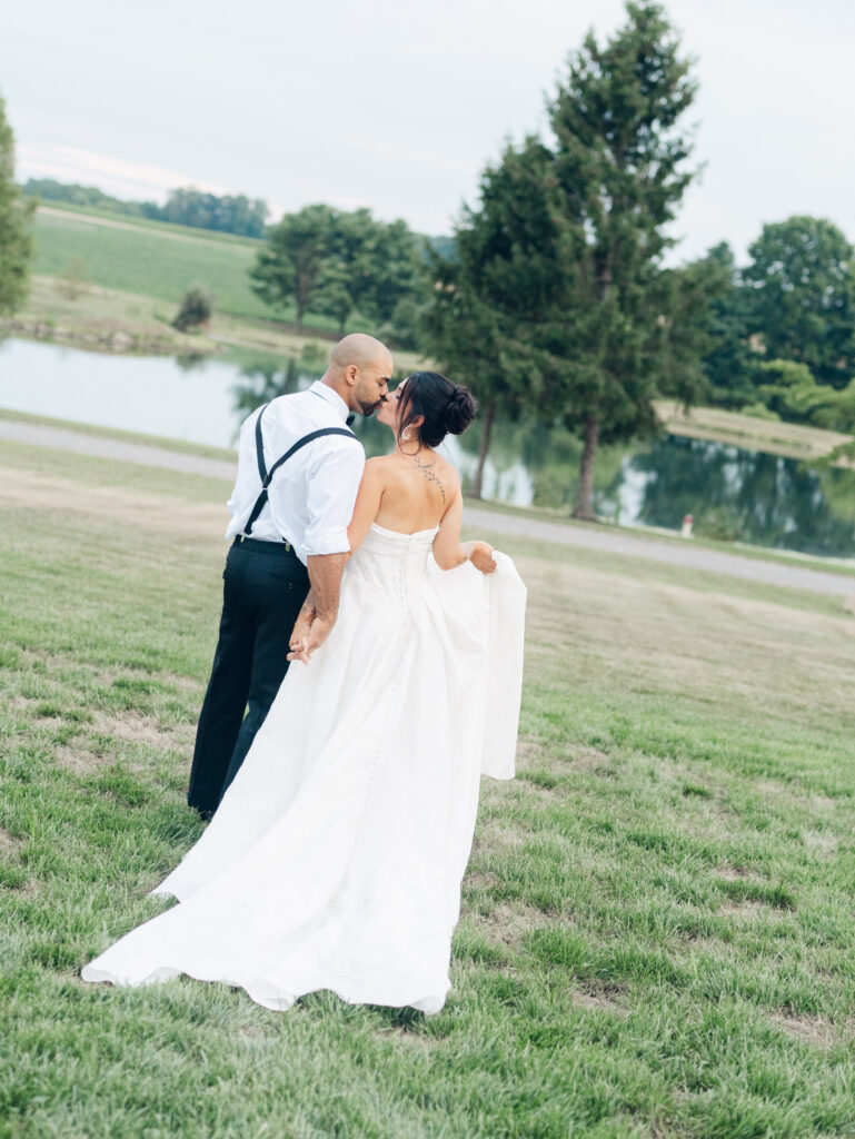 bride and groom taking photos at their wedding venue Bortner Valley in Hampstead, MD