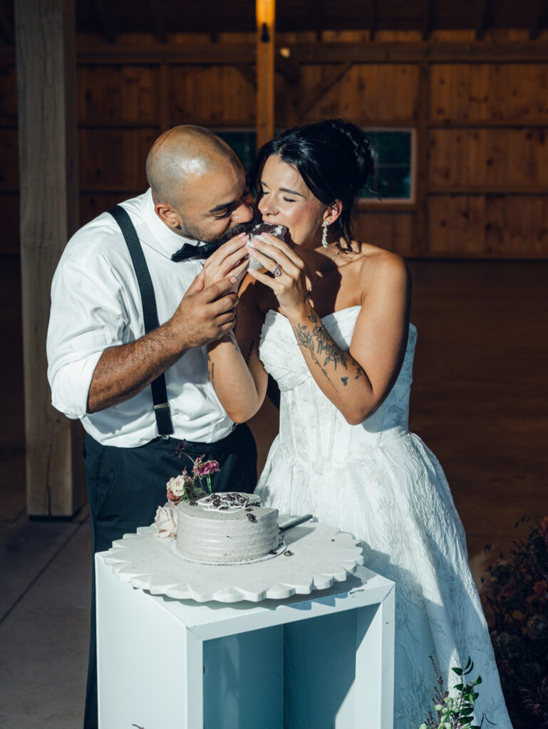 bride and groom cutting cake at their wedding venue Bortner Valley in Hampstead, MD