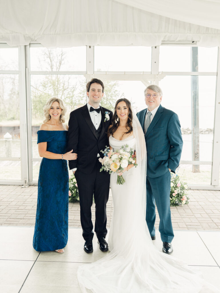 Bride and groom family photo on their wedding day by a Baltimore, MD documentary style wedding photographer