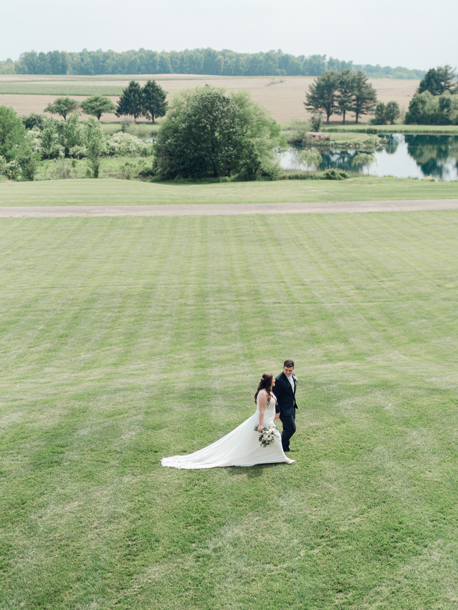 couple taking a moment to walk together because their wedding photography timeline is not rushed