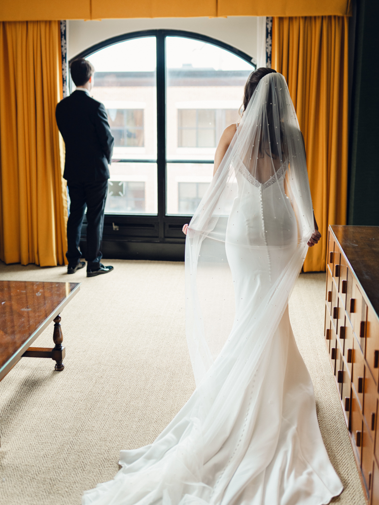 A moment of pause before the bride and groom's first look at the Graduate Hotel Annapolis