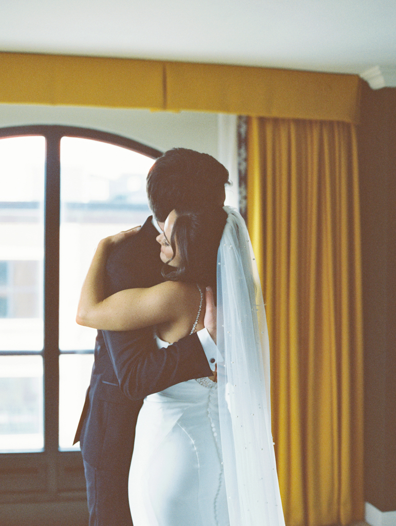 Bride and groom hugging after their first look at the Graduate Hotel Annapolis