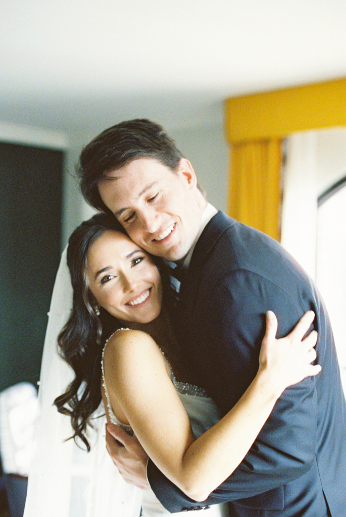 Bride and groom hugging after their first look at the Graduate Hotel Annapolis